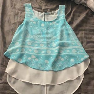 teal shirt with white under layer